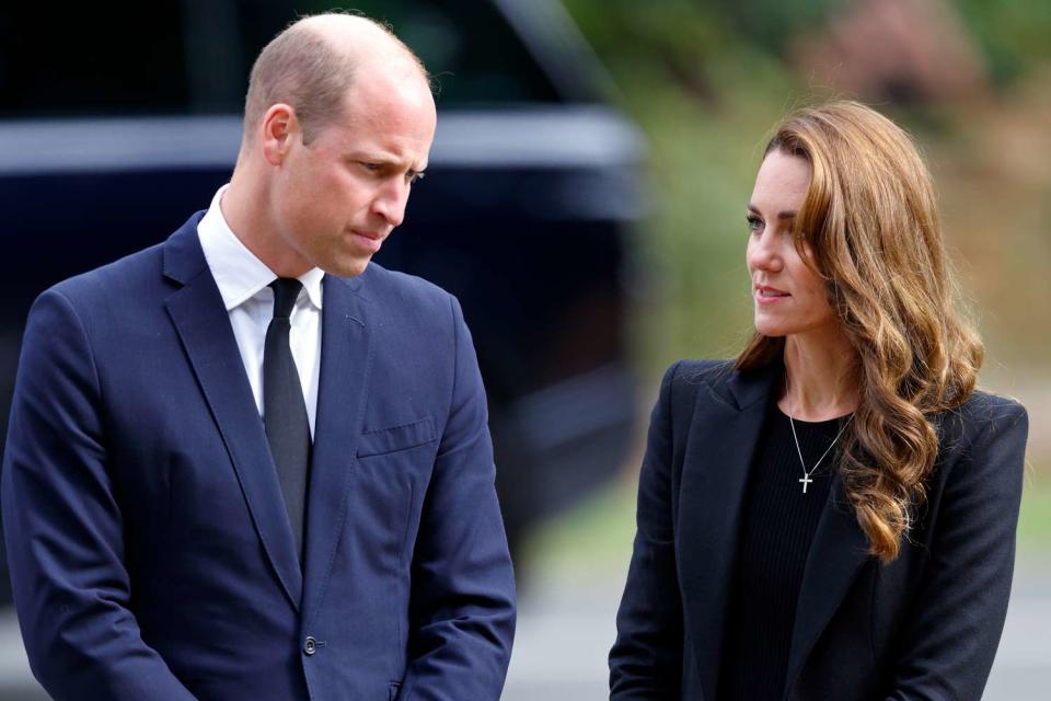 <p>Max Mumby/Indigo/Getty</p> Prince William and Kate Middleton view floral tributes left at the entrance to Sandringham House, the Norfolk estate of Queen Elizabeth, on September 15, 2022.