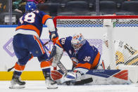 New York Islanders goaltender Ilya Sorokin (30) makes a save against the Pittsburgh Penguins during the second period of an NHL hockey game, Friday, Nov. 26, 2021, in Elmont, N.Y. (AP Photo/Eduardo Munoz Alvarez)