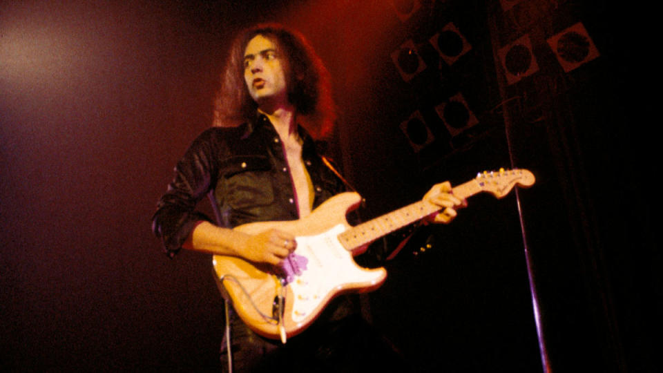 Photo of DEEP PURPLE and Ritchie BLACKMORE; with Deep Purple, performing live onstage, with spotlights and dry ice.