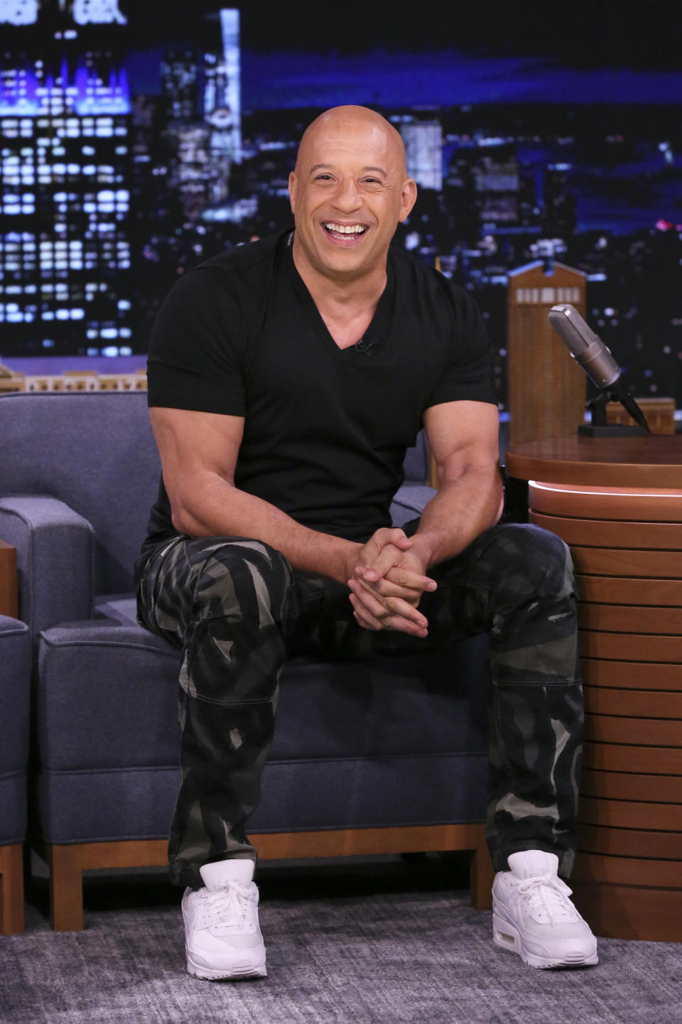 Vin Diesel sitting on a talk show stage