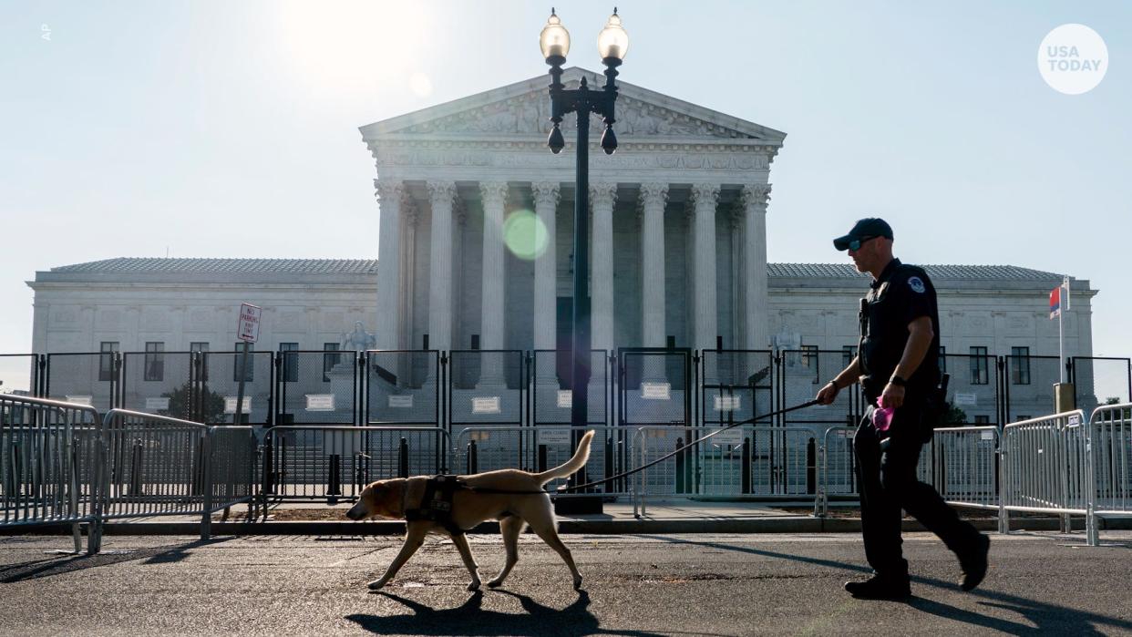 On Friday, a police officer leads a K9 around steel fencing and barricades surrounding the Supreme Court. The Supreme Court has ended constitutional protections for abortion that had been in place nearly 50 years in a decision by its conservative majority to overturn Roe v. Wade.