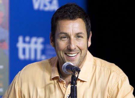 Actor Adam Sandler attends a news conference to promote the film "Men, Women & Children" at the Toronto International Film Festival (TIFF) in Toronto, September 6, 2014. REUTERS/Fred Thornhill