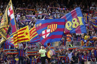 Barcelona fans bang drums, wave flags and chant before a Spanish La Liga soccer match between Barcelona and Mallorca at the Camp Nou stadium in Barcelona, Spain, Sunday, May 28, 2023. (AP Photo/Joan Monfort)