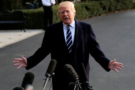 U.S. President Donald Trump speaks to reporters before departing the White House for New York in Washington, U.S., December 2, 2017. REUTERS/James Lawler Duggan