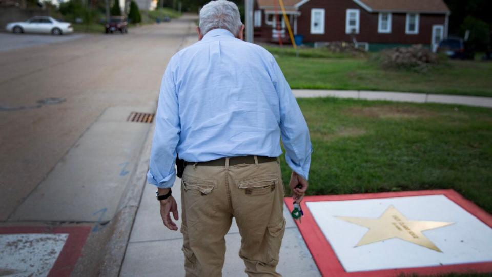 Sonny Soliz past his uncle's new steel star laid in concrete and his old, worn star. (Zamone Perez/Staff)