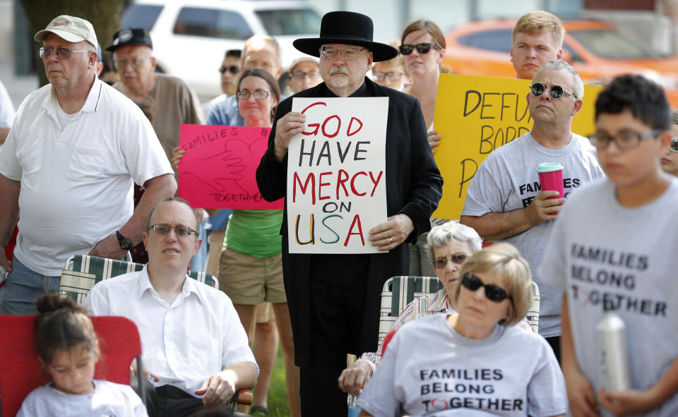 <p>Walden Paige, of Marshalltown, Iowa, center, looks on during a rally to protest the Trump administration’s immigration policies, Saturday, June 30, 2018, outside the Marshall County Courthouse in Marshalltown, Iowa. (Photo: Charlie Neibergall/AP) </p>