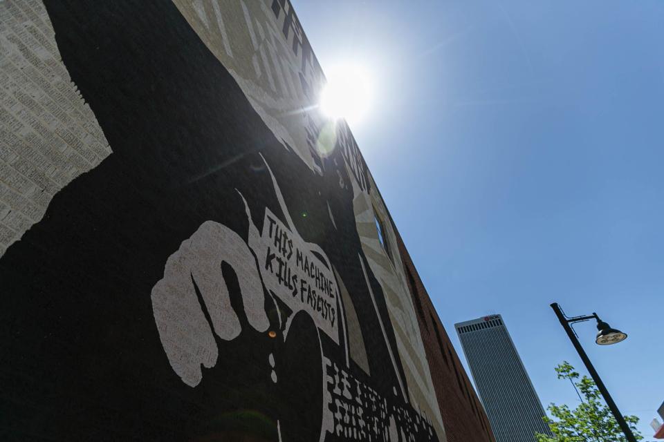 A mural stands tall outside the Woody Guthrie Center in Tulsa on Saturday, May 7, 2022.