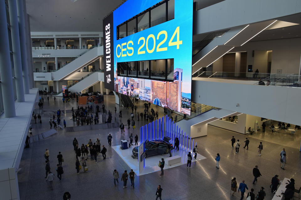 People walk through the Las Vegas Convention Center during the CES tech show, Wednesday, Jan. 10, 2024, in Las Vegas. (AP Photo/John Locher)