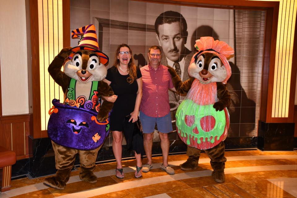 Disney Halloween on the High Seas Cruise - the writer and her husband with chip and dale in halloween costumes