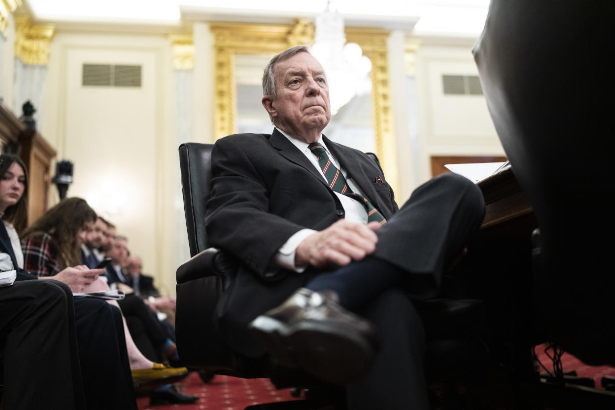 Sen. Richard Durbin, D-Ill., seated with an ornate gilt mirror in the background.