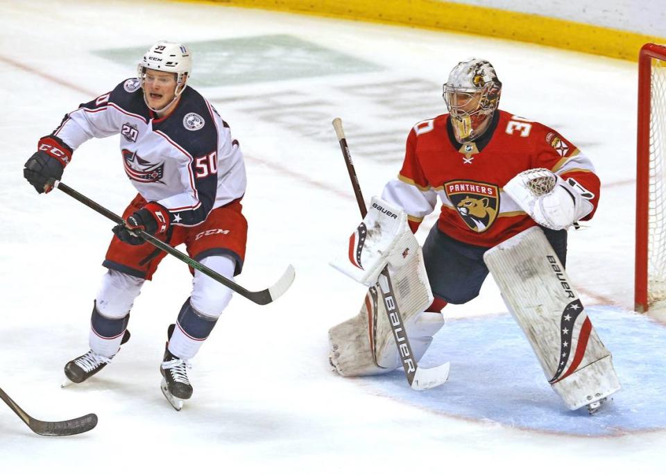 Florida Panthers goalie Spencer Knight (30) and Columbus Blue Jackets Eric Robinson (50) in the third period at the BB&T Center in Sunrise, Florida, Tuesday, April 20, 2021.