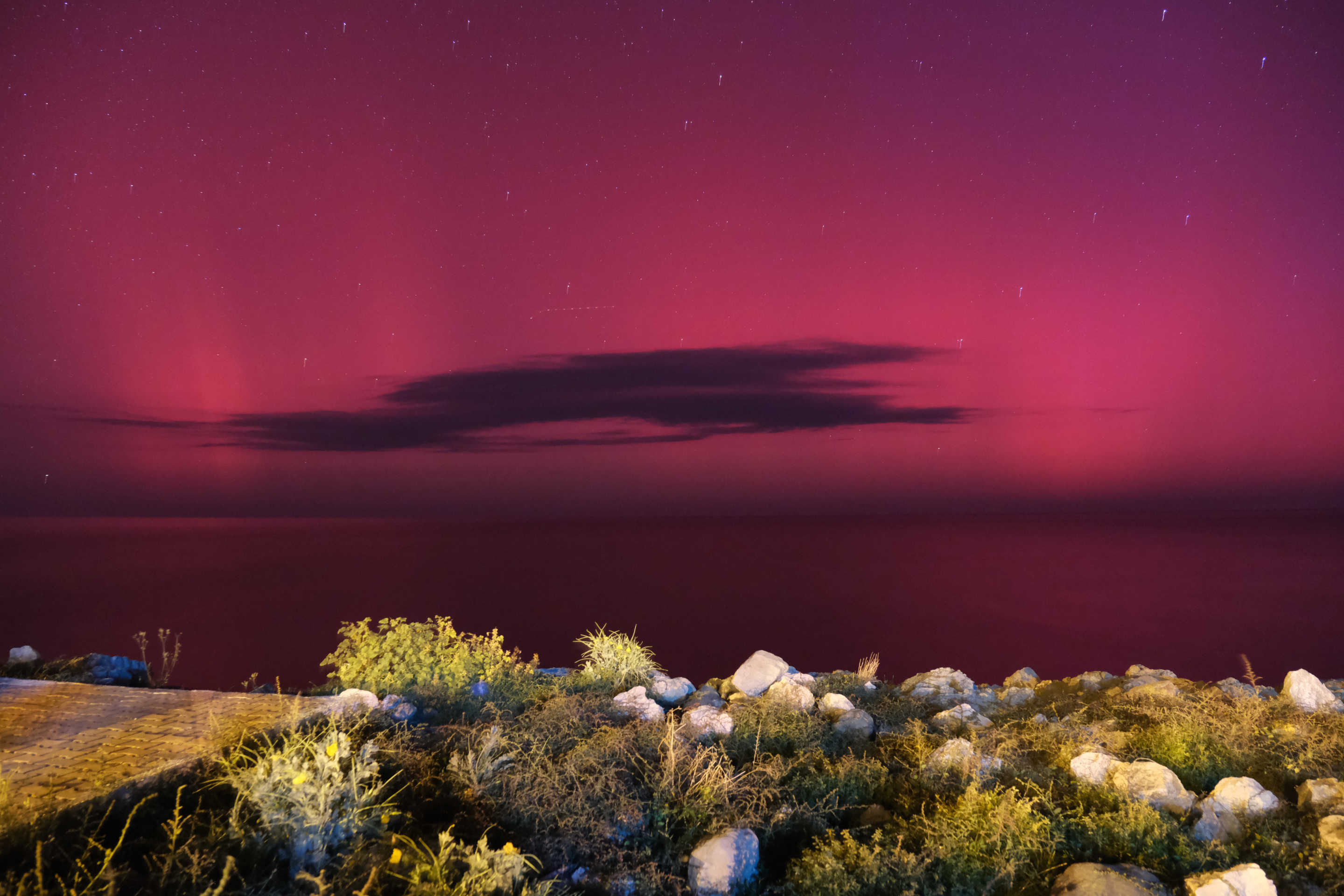 Northern lights (Aurora Borealis) illuminate the sky in Bozkurt district, Kastamonu, Turkiye on October 11, 2024. (Umit Yorulmaz/Anadolu via Getty Images)