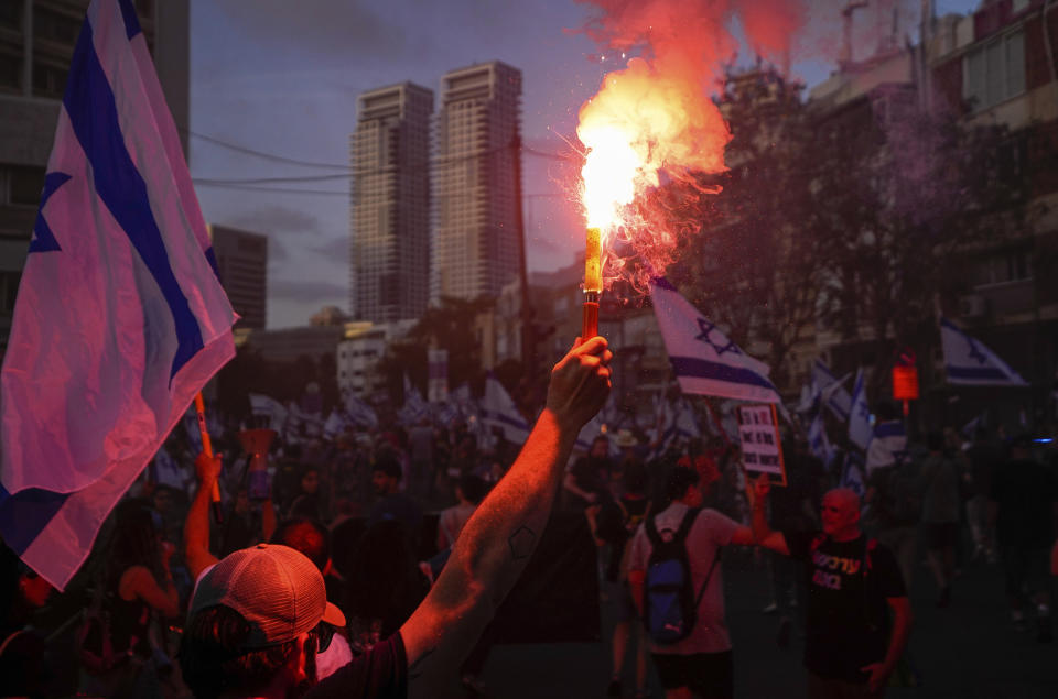 Israelis protest against plans by Prime Minister Benjamin Netanyahu's government to overhaul the judicial system in Tel Aviv, Saturday, June 3, 2023. (AP Photo/Ariel Schalit)