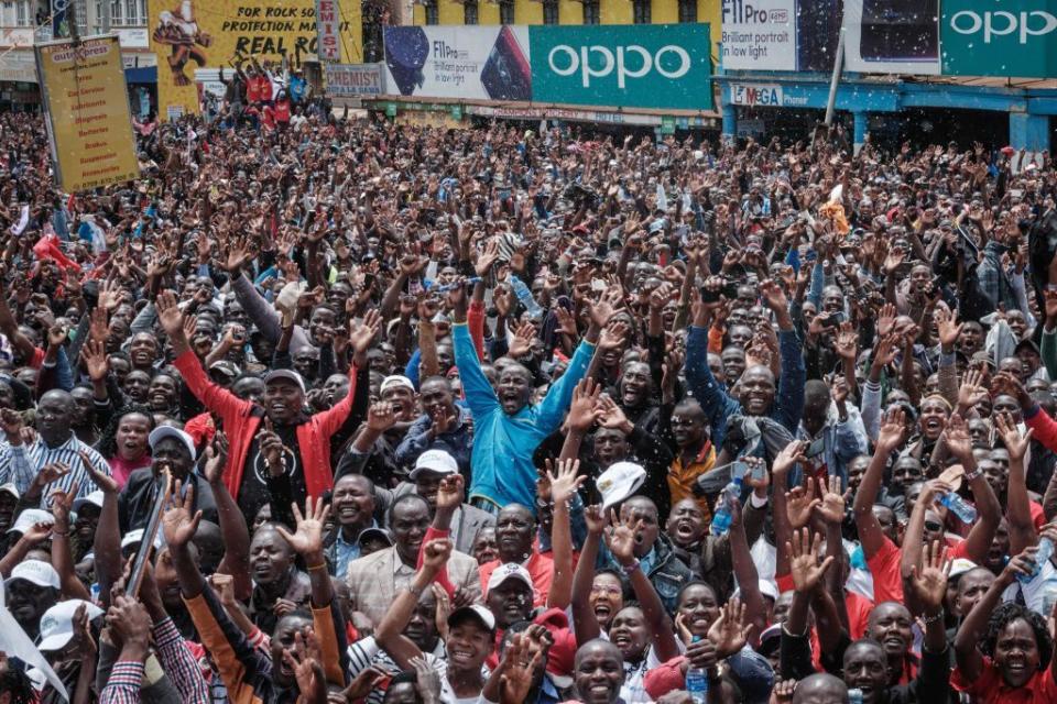 Spectators celebrating Kipchoge's victory in Nairobi