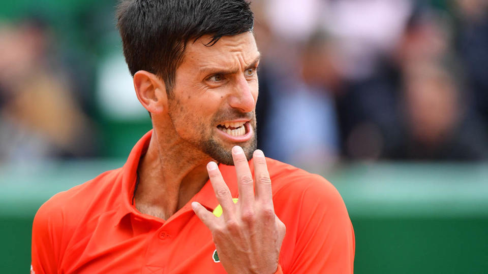 Novak Djokovic wasn’t happy. (Photo by YANN COATSALIOU/AFP/Getty Images)