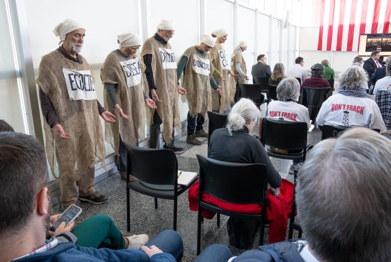 Protestors stage a demonstration during a meeting of the The Ohio Oil and Gas Land Management Commission at the Charles D. Shipley Building Atrium. The Commission selected Texas-based Encino Energy for fracking under Valley Run Wildlife Area in Carroll County and Zepernick Wildlife Area in Columbiana County.