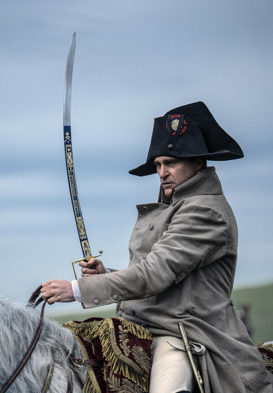 This image released by Apple TV+ shows Joaquin Phoenix in a scene from "Napoleon." (Kevin Baker/Apple TV+ via AP)