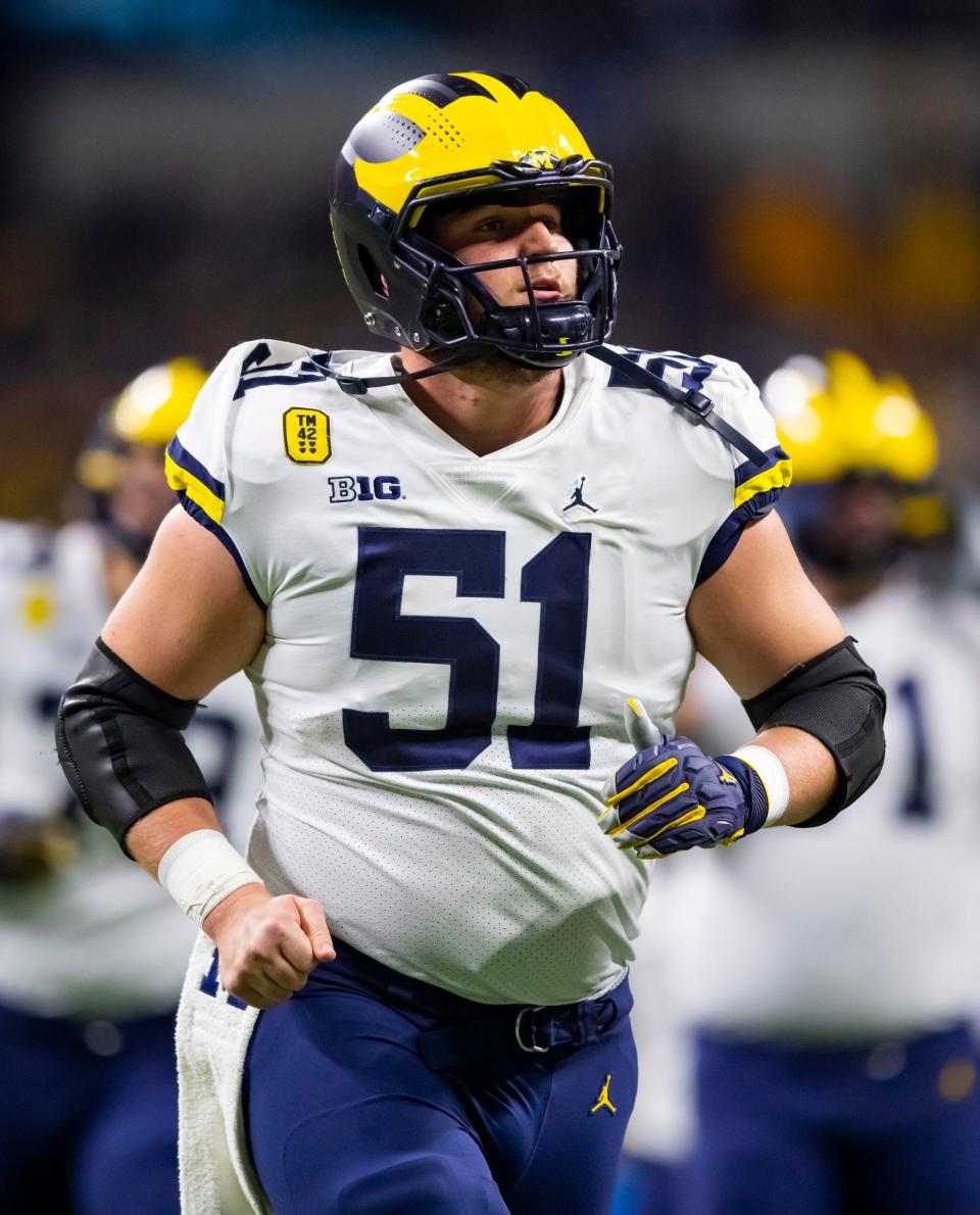 Michigan Wolverines offensive lineman Greg Crippen gets ready for a game against the Iowa Hawkeyes for the Big Ten Conference championship.
