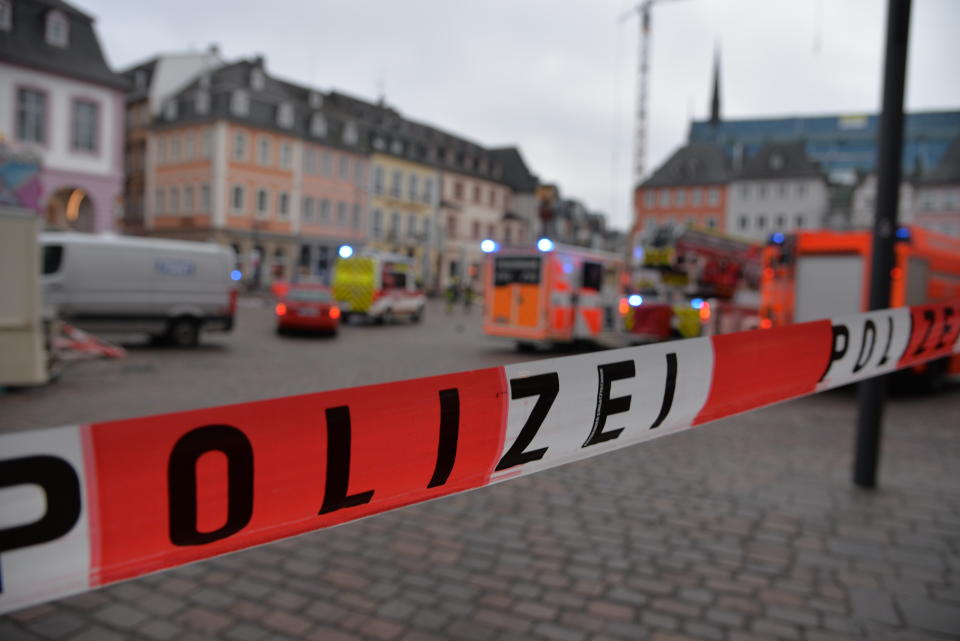 A square is blocked by the police in Trier, Germany, Tuesday, Dec. 1, 2020. German police say two people have been killed and several others injured in the southwestern German city of Trier when a car drove into a pedestrian zone. Trier police tweeted that the driver had been arrested and the vehicle impounded. (Harald Tittel/dpa via AP)