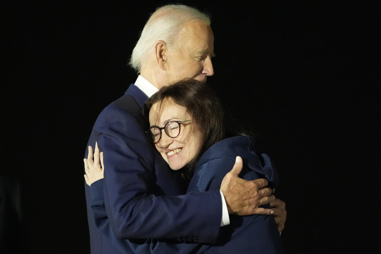 President Joe Biden hugs Alsu Kurmasheva at Andrews Air Force Base.