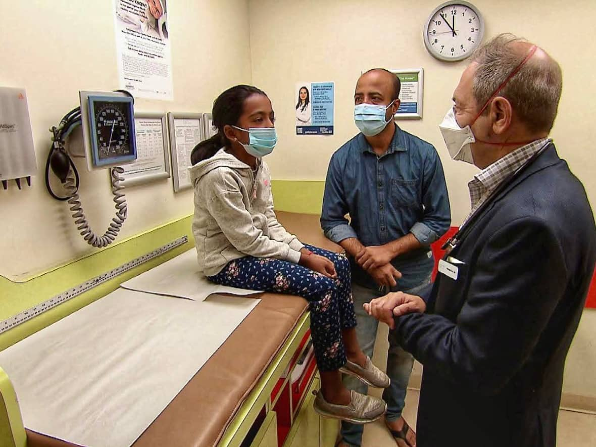 Dr. Benjamin Burko tends to a patient at Tiny Tots in Decarie Square. Tiny Tots is part of ELNA Medical's growing network of family medicine and specialty clinics in Canada, with about 25 clinics in Quebec alone. (Dave St-Amant/CBC - image credit)