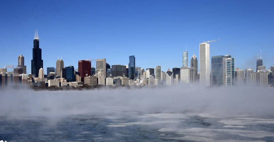 The Chicago Skyline sits as a backdrop as fog drifts across Monroe Harbor with temperatures well below zero and wind chills expected to reach 40 to 50 below, Monday, Jan. 6, 2014, in Chicago. A whirlpool of frigid, dense air known as a "polar vortex" descended Monday into much of the U.S. (AP Photo/Charles Rex Arbogast)