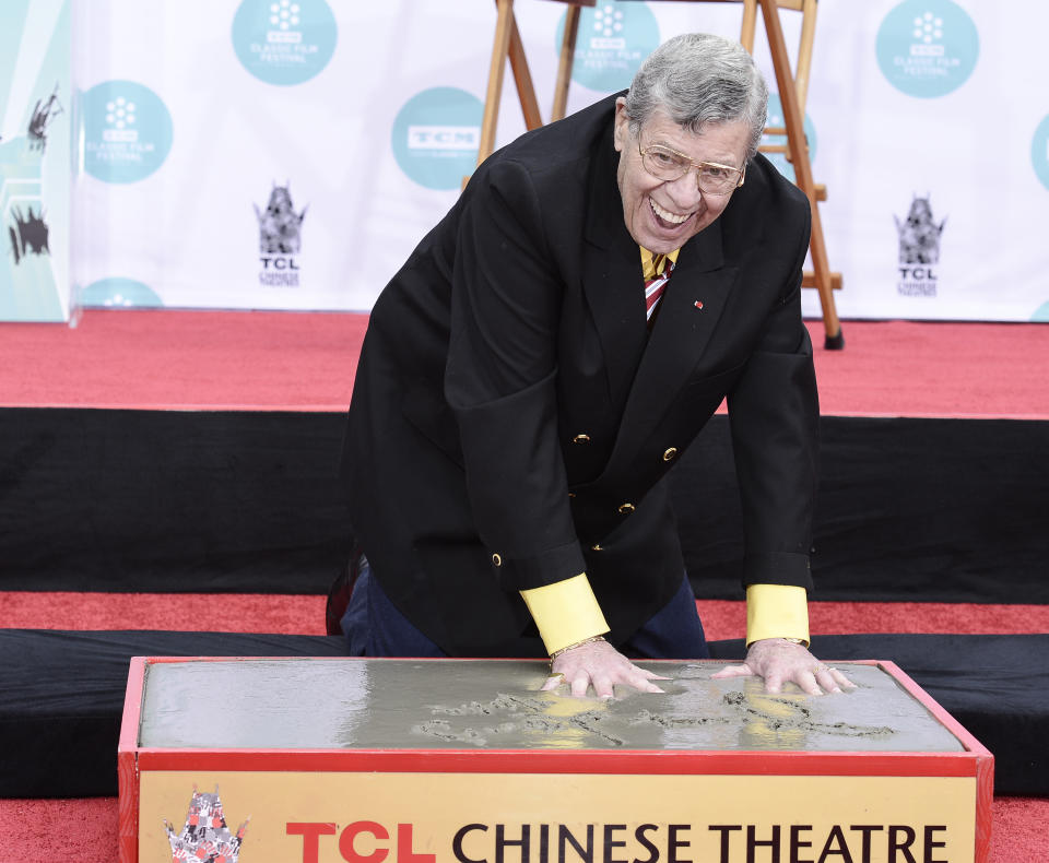 Actor and comedian Jerry Lewis is honored with a hand and footprint ceremony at TCL Chinese Theatre on Saturday, April 12, 2014 in Los Angeles. (Photo by Dan Steinberg/Invision/AP Images)