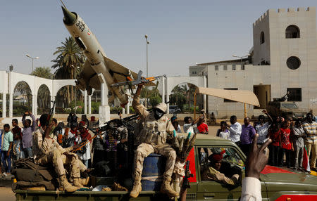 Sudanese soldiers are seen on their vehicles as they move with a military convoy outside the defense ministry compound in Khartoum, Sudan, April 25, 2019. REUTERS/Umit Bektas