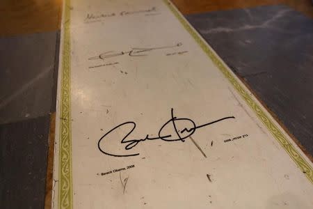 A reproduction of former U.S. President Barak Obama's signature is seen on a floor along with the signatures of other past guests at the King David Hotel, in Jerusalem May 18, 2017. REUTERS/Ronen Zvulun