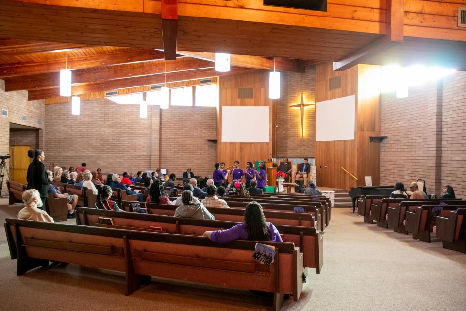 People listen as teens from Enhance the Gift Visual and Performing Arts Academy of Moreno Valley sing during a Dr. Martin Luther King, Jr. Day event at First Community Baptist Church in Desert Hot Springs, Calif., on Monday, Jan. 15, 2024.