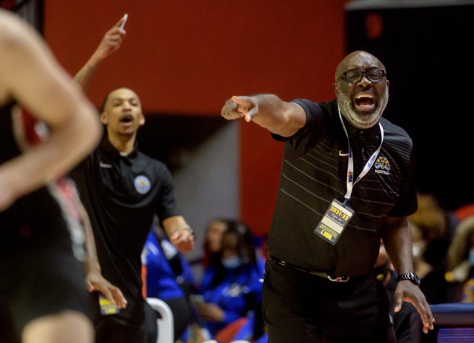 Chicago Simeon head coach Robert Smith yells instructions to his team as they fall behind Metamora late in the fourth quarter of their Class 3A state semifinal Friday, March 11, 2022 at the State Farm Center in Champaign. The Redbirds advanced to the state title game with a 50-47 win.