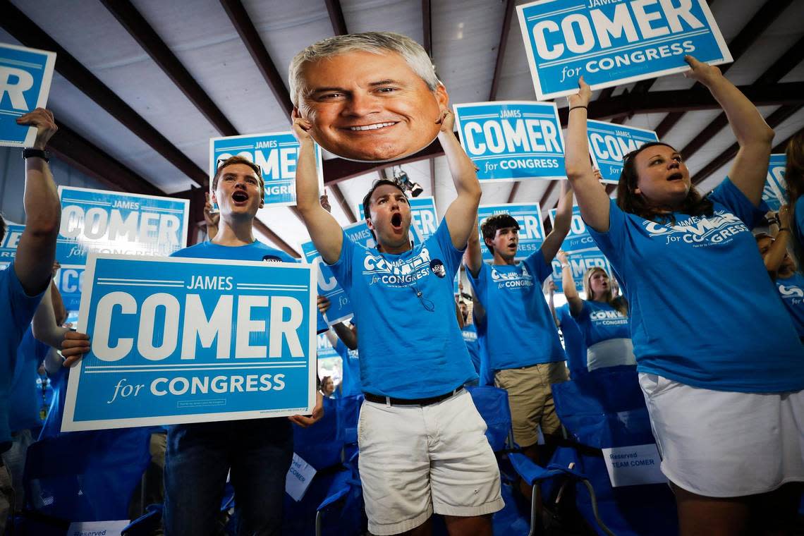 Supporters of U.S. Rep. James Comer cheer as he takes the stage for his speech during the 141st Fancy Farm Picnic at St. Jerome Catholic Church in Fancy Farm, Ky., Saturday, Aug. 7, 2021.