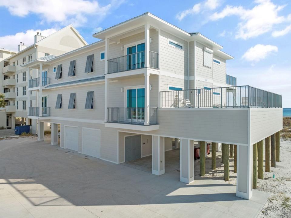 The highest-selling beach home in Escambia and Santa Rosa County history is this residence located on Gulf Boulevard in Navarre Beach. The 9-bed, 9-bath home has three floor levels with an elevator, built-in swimming pool, private access to the beach and more.