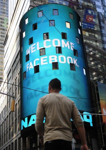 A sign welcoming Facebook is flashed on a screen outside the NASDAQ stock exchange in Times Square in New York on May 18