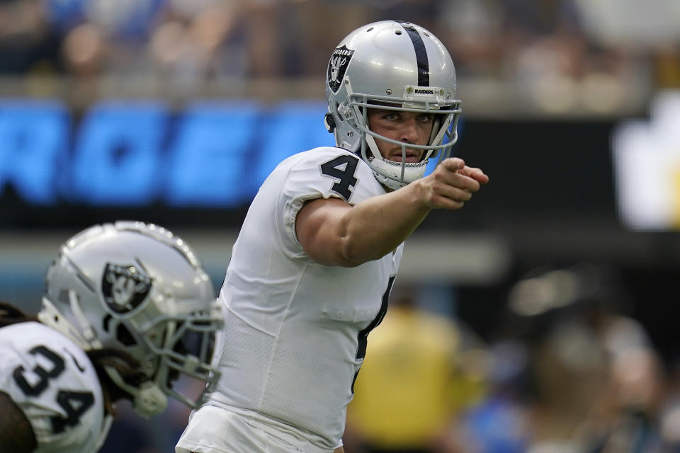 Las Vegas Raiders quarterback Derek Carr (4) gestures toward teammates during the first half of an NFL football game against the Los Angeles Chargers in Inglewood, Calif., Sunday, Sept. 11, 2022. (AP Photo/Gregory Bull)