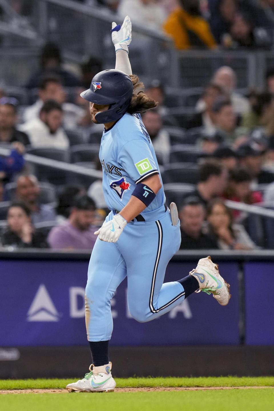 Toronto Blue Jays' Bo Bichette celebrates while sunning the bases on his home run against the New York Yankees during the fifth inning of a baseball game Tuesday, Sept. 19, 2023, in New York. (AP Photo/Bryan Woolston)