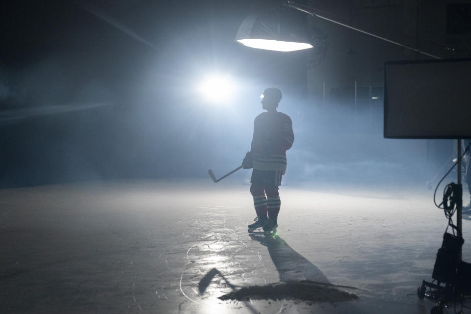 Chicago Blackhawks hockey player Connor Bedard, the number one overall draft pick, stands under the lights during the NHL Players Association rookie showcase, Tuesday, Sept. 5, 2023 in Arlington, Va. (AP Photo/Alex Brandon)