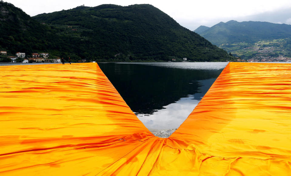 People walk on water at Italian lake 'Floating Piers’ installation