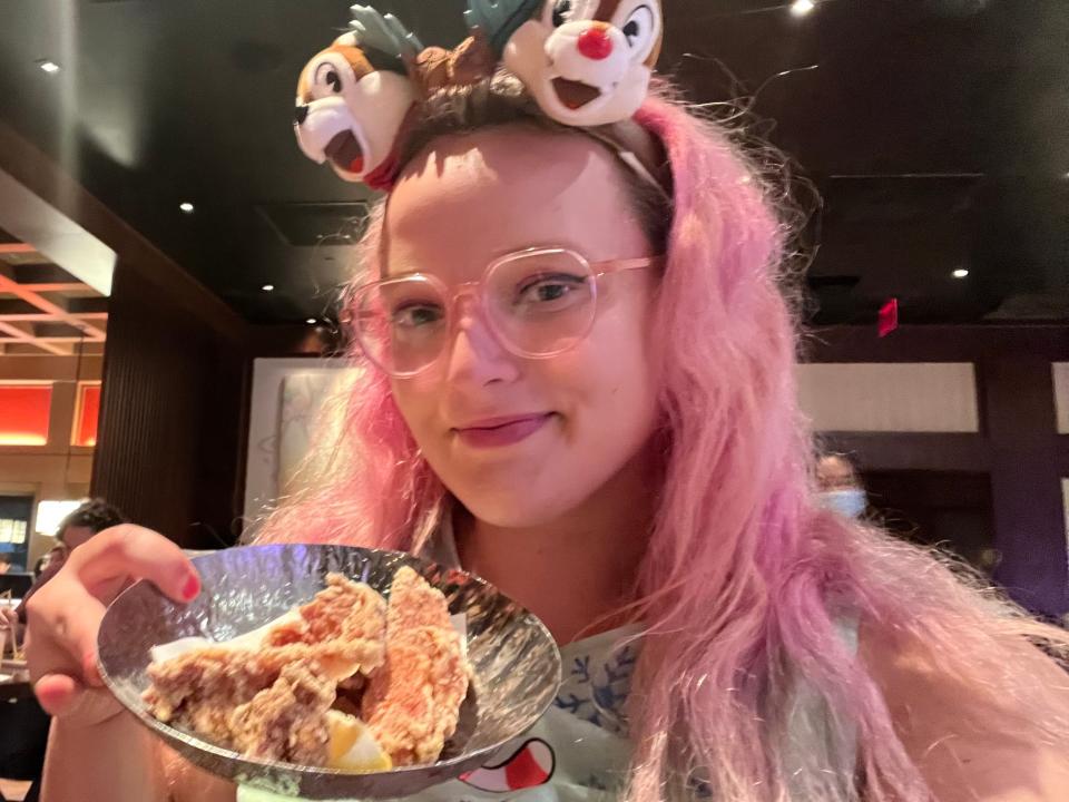 Author holding up plate of chicken karaage