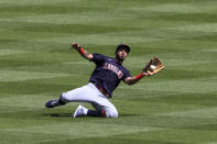 Cleveland Indians' Eddie Rosario makes a catch for an out during the fifth inning of a baseball game in Cincinnati, Sunday, April 18, 2021. (AP Photo/Aaron Doster)