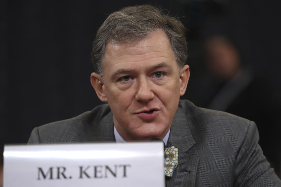 Career Foreign Service officer George Kent testifies before the House Intelligence Committee on Capitol Hill in Washington, Wednesday, Nov. 13, 2019, during the first public impeachment hearing of President Donald Trump's efforts to tie U.S. aid for Ukraine to investigations of his political opponents. (AP Photo/Andrew Harnik)