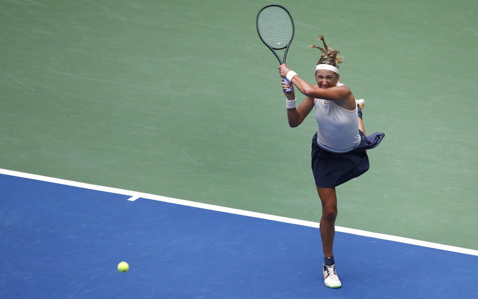 Victoria Azarenka, of Belarus, returns a shot to Sloane Stephens during the third round of the U.S. Open tennis tournament, Friday, Aug. 31, 2018, in New York. (AP Photo/Jason DeCrow)