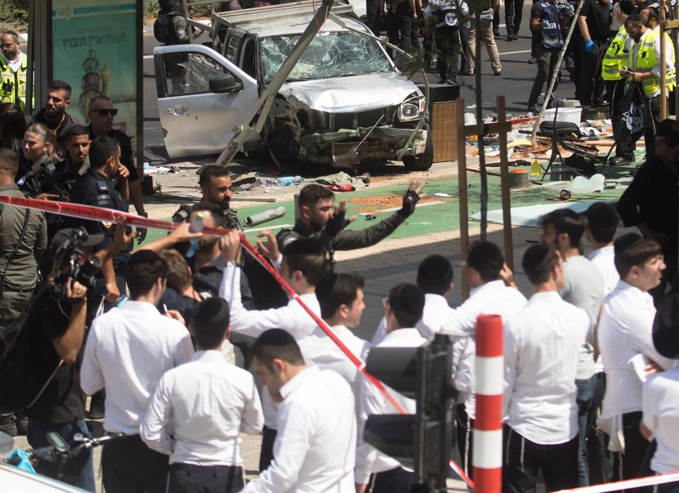 Israeli security and rescue forces examine the scene of a terror attack (Getty)