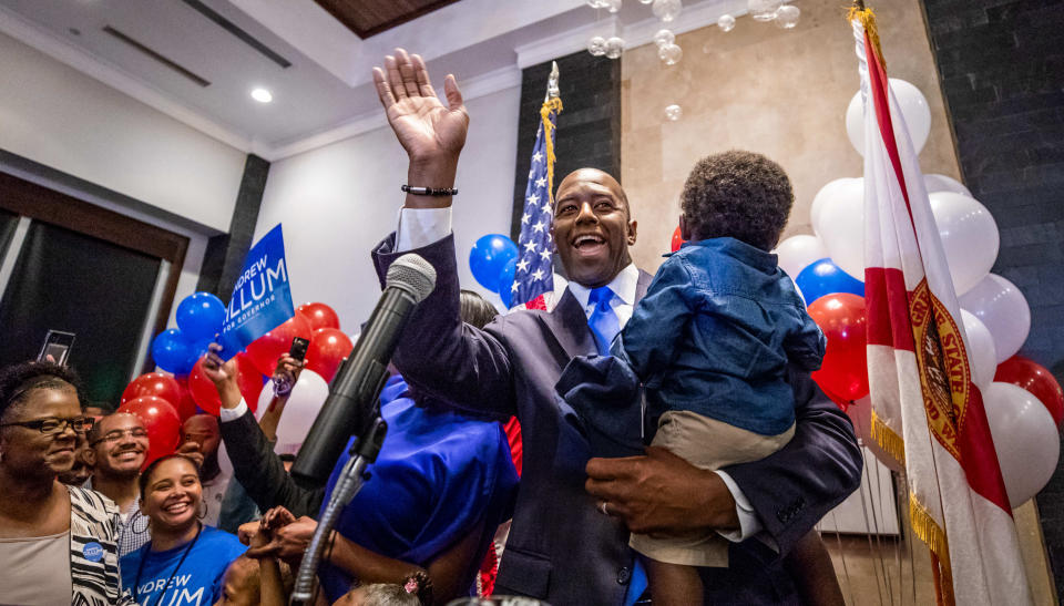 Andrew Gillum, holding son Davis, celebrates winning the Democratic primary for governor Tuesday night in Tallahassee, Fla. (Photo: Colin Hackley/Tampa Bay Times via Zuma Wire)