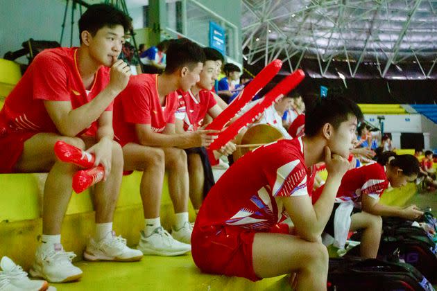 Chinese badminton players watch the 2024 Asia Junior Championship in Indonesia on July 1, 2024, one day after the sudden death of player Zhang Zhijie.