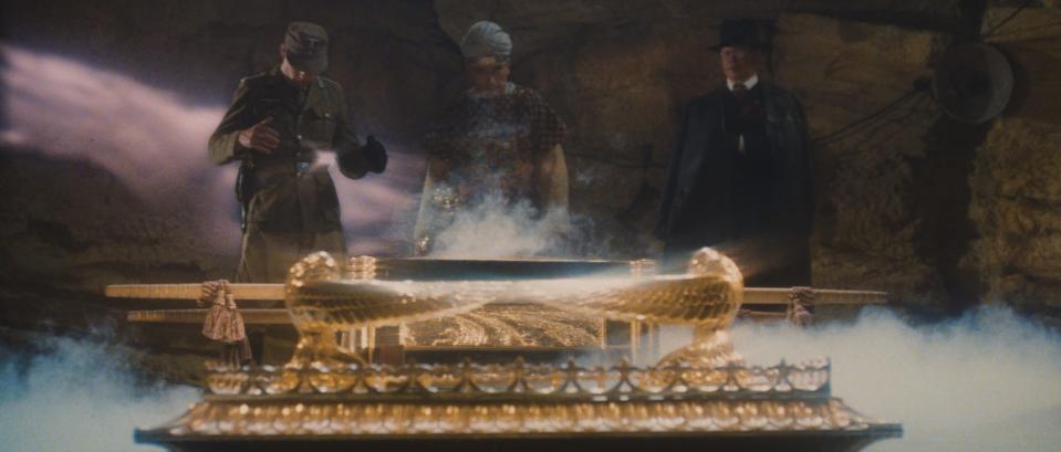 Dietrich (Wolf Kahler, far left), Belloq (Paul Freeman) and Toht (Ronald Lacey) peer inside the opened Ark of the Covenant before bad things happen to their faces in "Raiders of the Lost Ark."