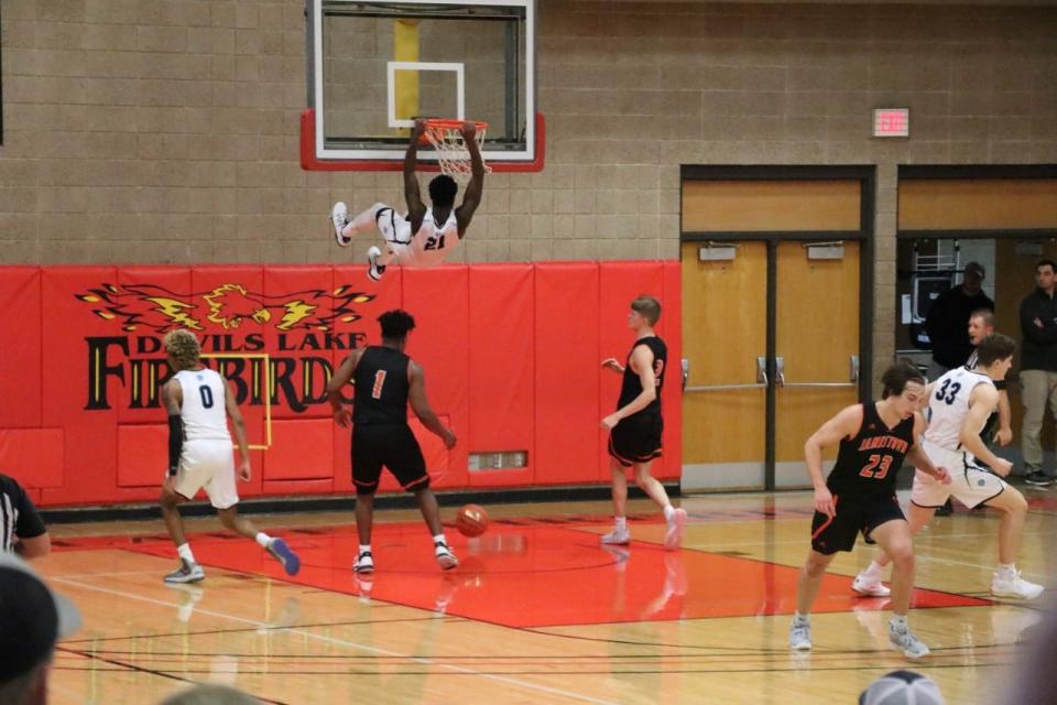 Lake Region State forward Clarence Daniels dunks the basketball at Devils Lake Sportscenter.