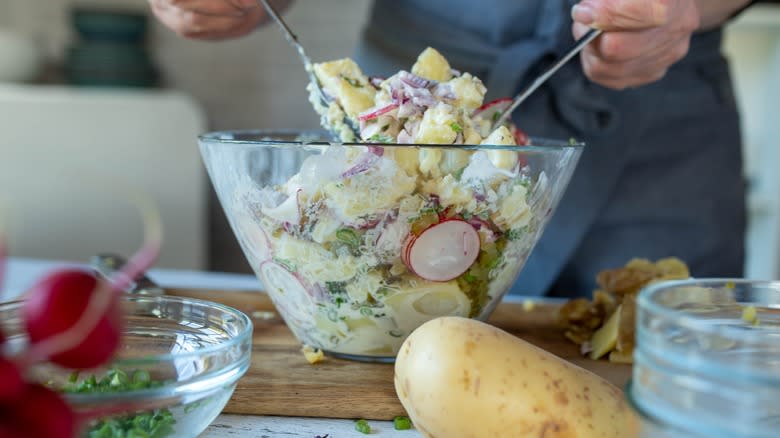 preparing potato salad in mixing bowl