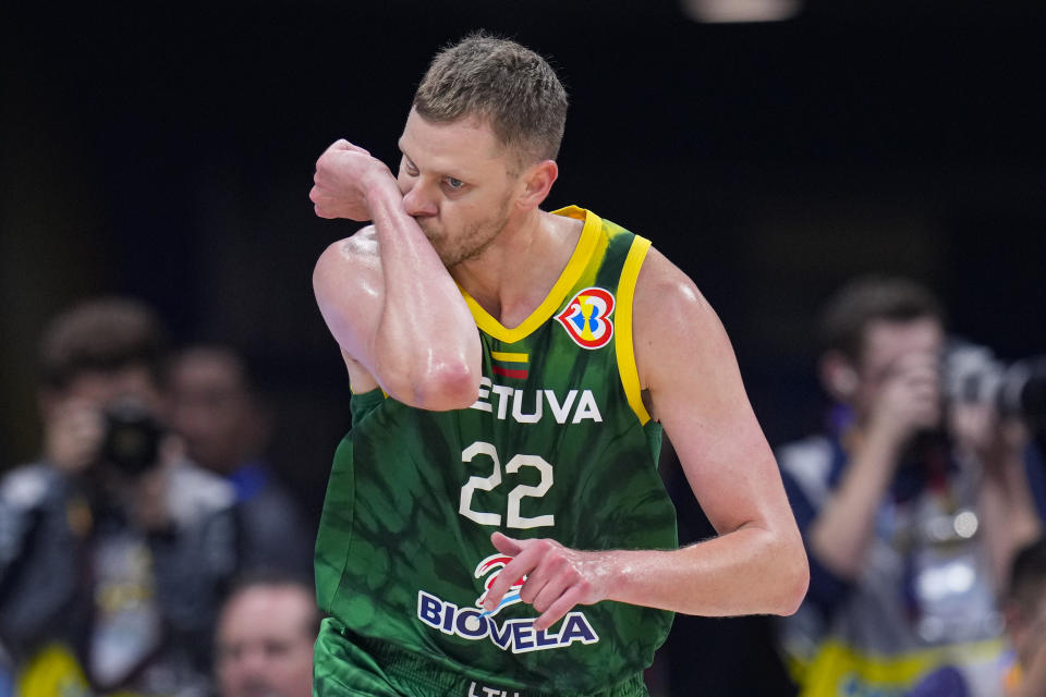 Lithuania forward Eimantas Bendzius (22) reacts after a three-point basket against the United States during the second half of a Basketball World Cup second-round match in Manila, Philippines Sunday, Sept. 3, 2023.(AP Photo/Michael Conroy)