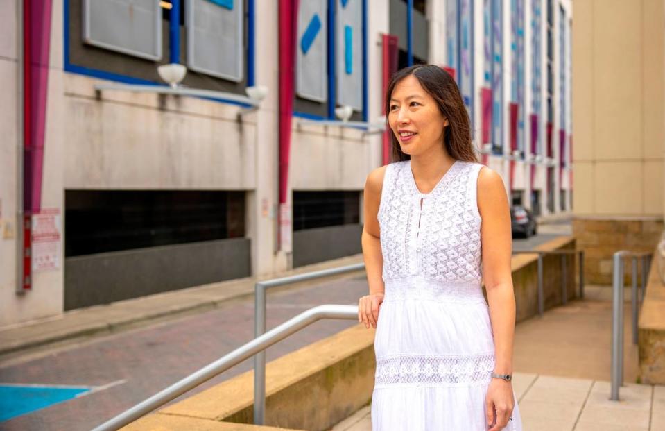 Jinna Kim, shown in front of the Levine Museum of the New South in Charlotte, has spent almost a decade acting in Charlotte after starting as a background extra in the series “Homeland.” Kim has also directed her own film, but her main profession is writing patents for Bank of America.